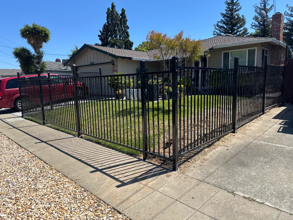 Ornamental iron fence with matching pedestrian gate in Gilroy