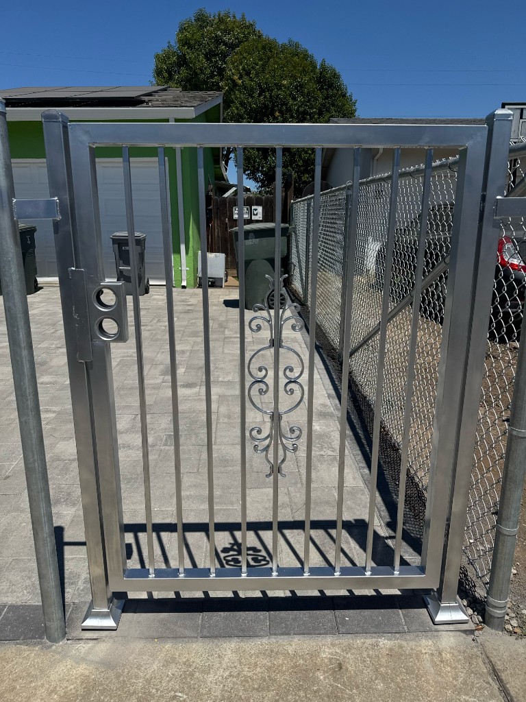 Custom ornamental pedestrian gate with scroll detail in Gilroy