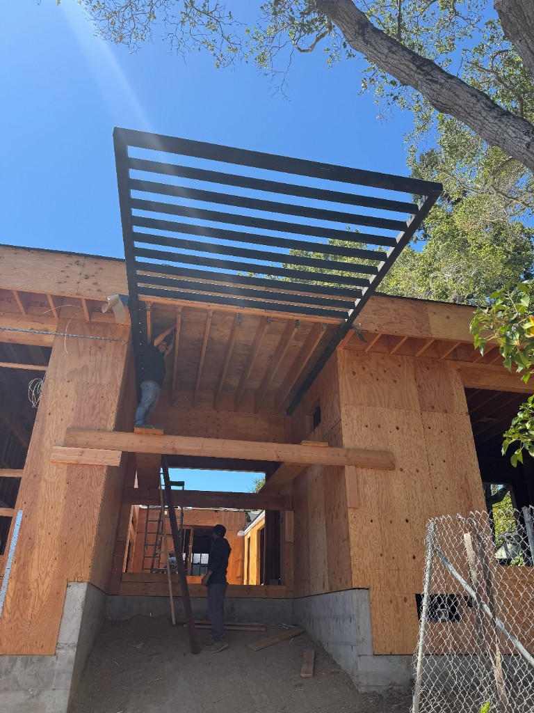 Steel trellis canopy structure fabricated for a building in Belmont