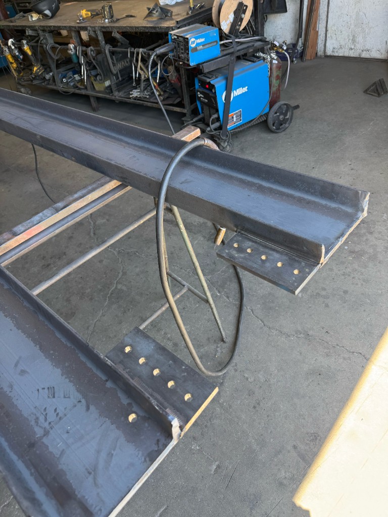 Art's Iron Works fabrication shop with steel beams and welding equipment in San Jose